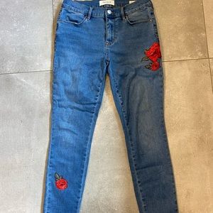 PACSUN light wash denim with flower detailing!
